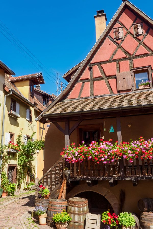 street-with-colorful-traditional-french-houses-in-eguisheim-france